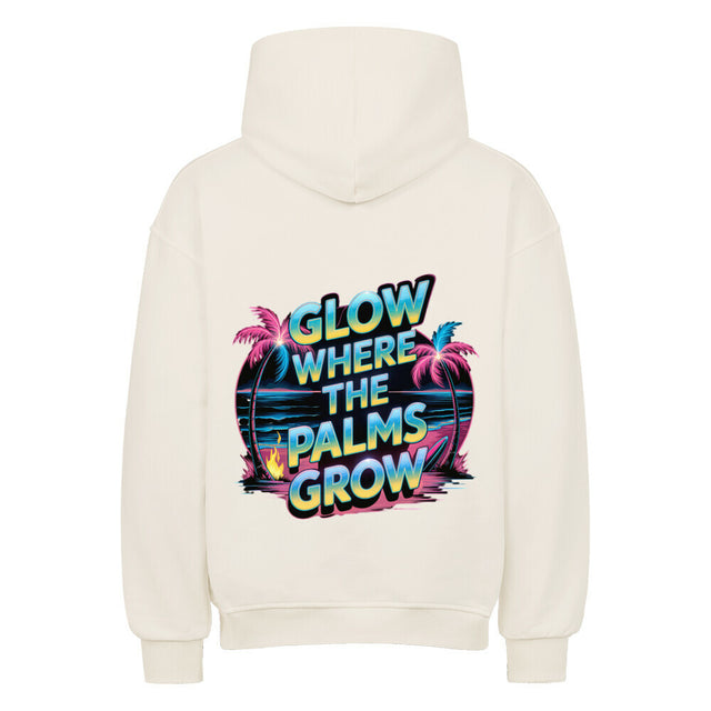 Premium Oversized Hoodie „Glow Where the Palms Grow“ von TeeTreeTrendz mit tropischem Palmen-Design, Neon-Schriftzug und Retro-Sonnenuntergang in vibranten Farben