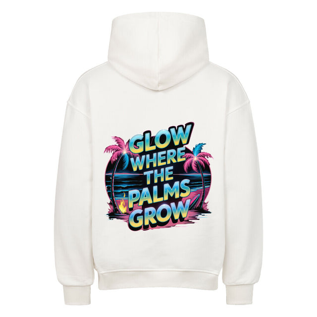 Premium Oversized Hoodie „Glow Where the Palms Grow“ von TeeTreeTrendz mit tropischem Palmen-Design, Neon-Schriftzug und Retro-Sonnenuntergang in vibranten Farben