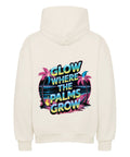 Premium Oversized Hoodie „Glow Where the Palms Grow“ von TeeTreeTrendz mit tropischem Palmen-Design, Neon-Schriftzug und Retro-Sonnenuntergang in vibranten Farben
